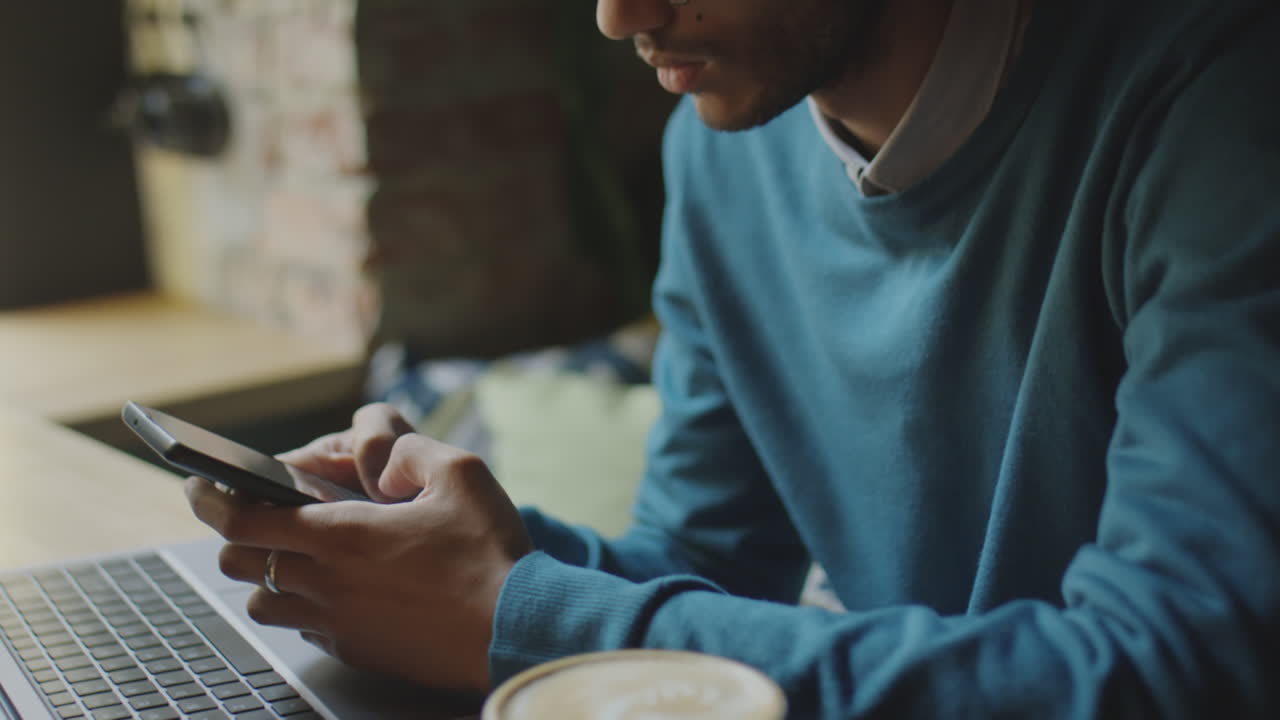 Businessman Texting Phone in Coffeeshop