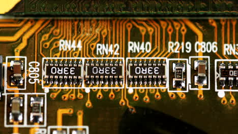 close up of resistors of a computer circuit board