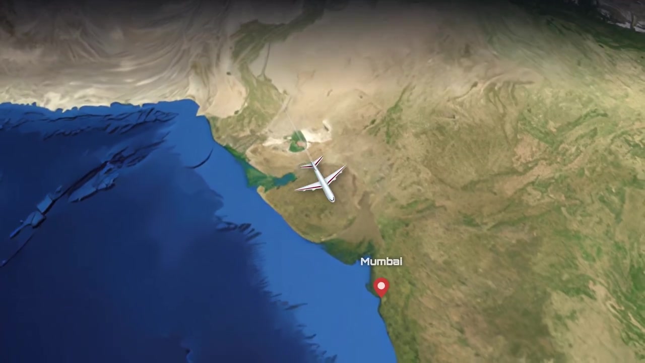 A commercial airplane flies across a realistic 3D globe from North America to India