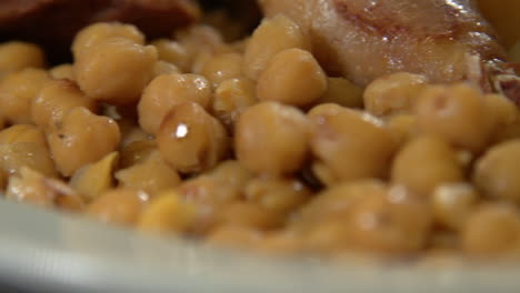 close up of cocido madrileño, traditional chickpea-based stew from madrid, spain