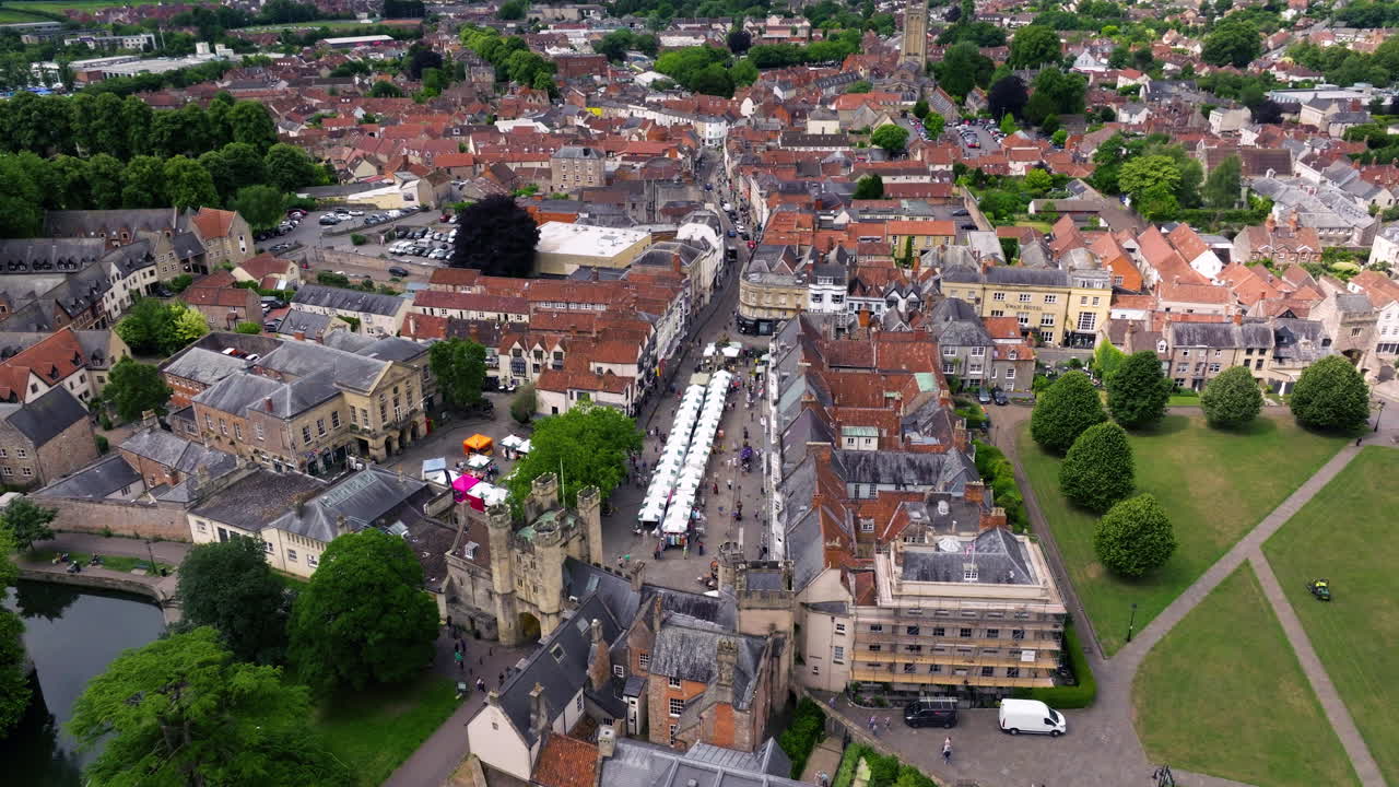 The Wells Market In The Market Place In Wells, Somerset, Near Bishop's Palace, England. Aerial Drone Shot