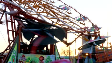 spinning empty ferris wheels building pan shot day maharashtra india close up covid lockdown