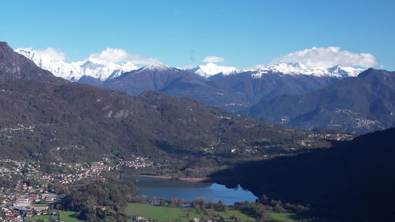 Stunning aerial view of the Italian Alps with a serene lake below