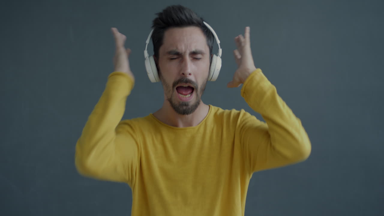 Man Dancing to Music with Headphones