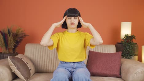 woman with migraine is experiencing pain.