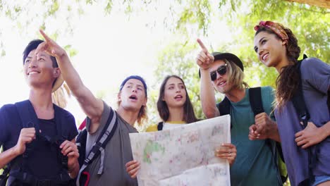 friends looking at map and pointing at distance 4k