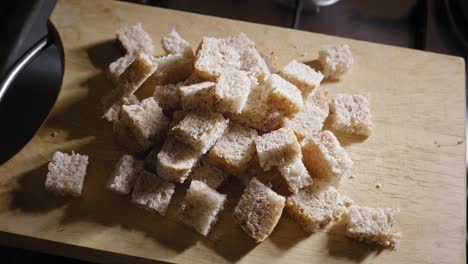 cubed bread on wooden chopping board for cooking toast omelette