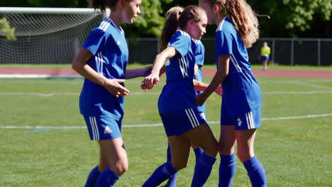 youth soccer team supporting a teammate