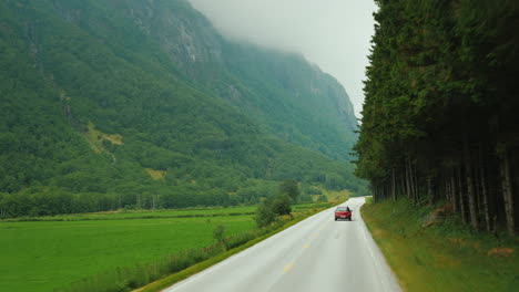 go along the scenic road among the mountains of norway first-person view