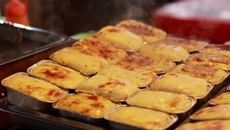 freshly steamed cakes at a floating market