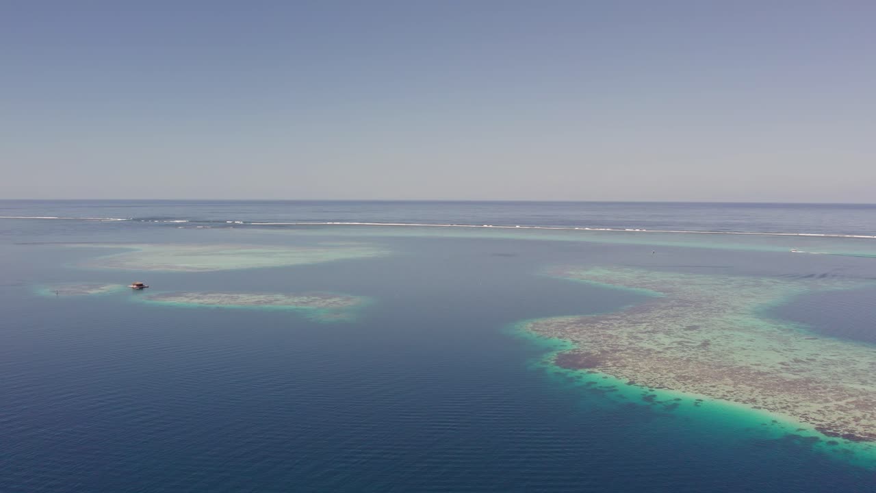 Aerial Orbit of the Stunning Coral Reef on the Beaches of Tahiti