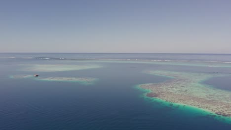 aerial orbit of the stunning coral reef on the beaches of tahiti