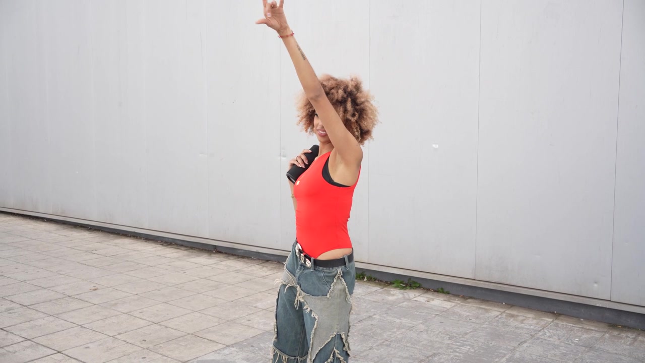 A casual fashion portrait of a trendy and stylish woman with beautiful curly hair