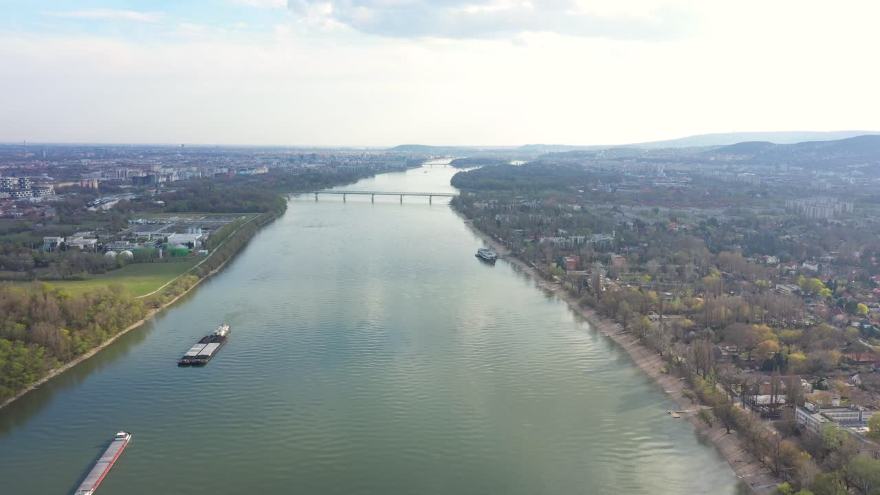 Drone footage from Danube river in spring nice weather, Budapest drone moves fast forward on high altitude