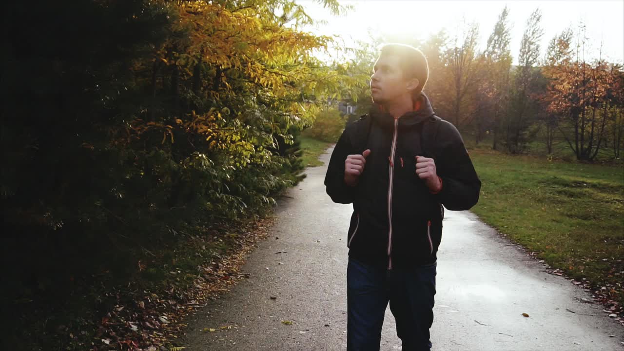 Man Hiking in Autumn Park