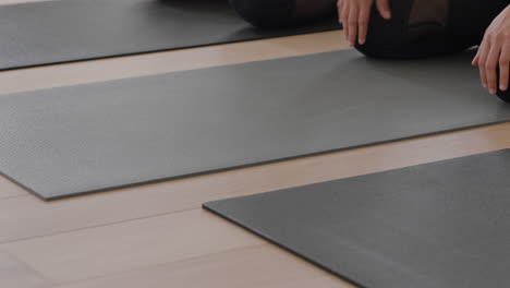 yoga class group of healthy women practicing childs pose enjoying morning workout exercising in fitness studio