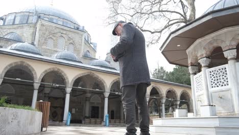 Phone-in-courtyard-mosque