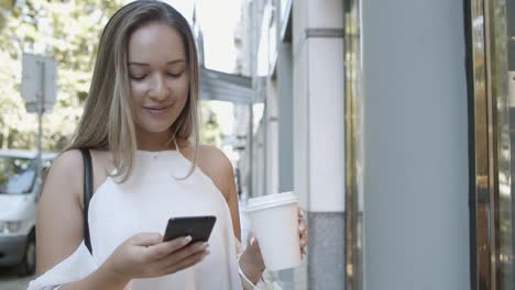 caucasian woman browsing via smartphone, reading chat