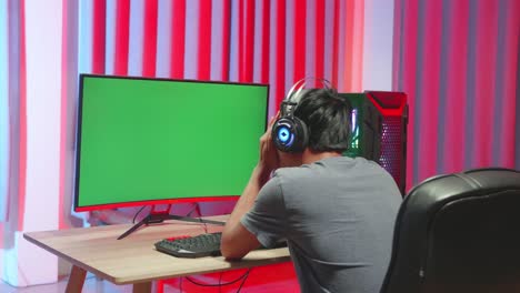 gamer losing with green screen display