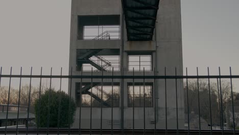 a large structure with stairs at dusk