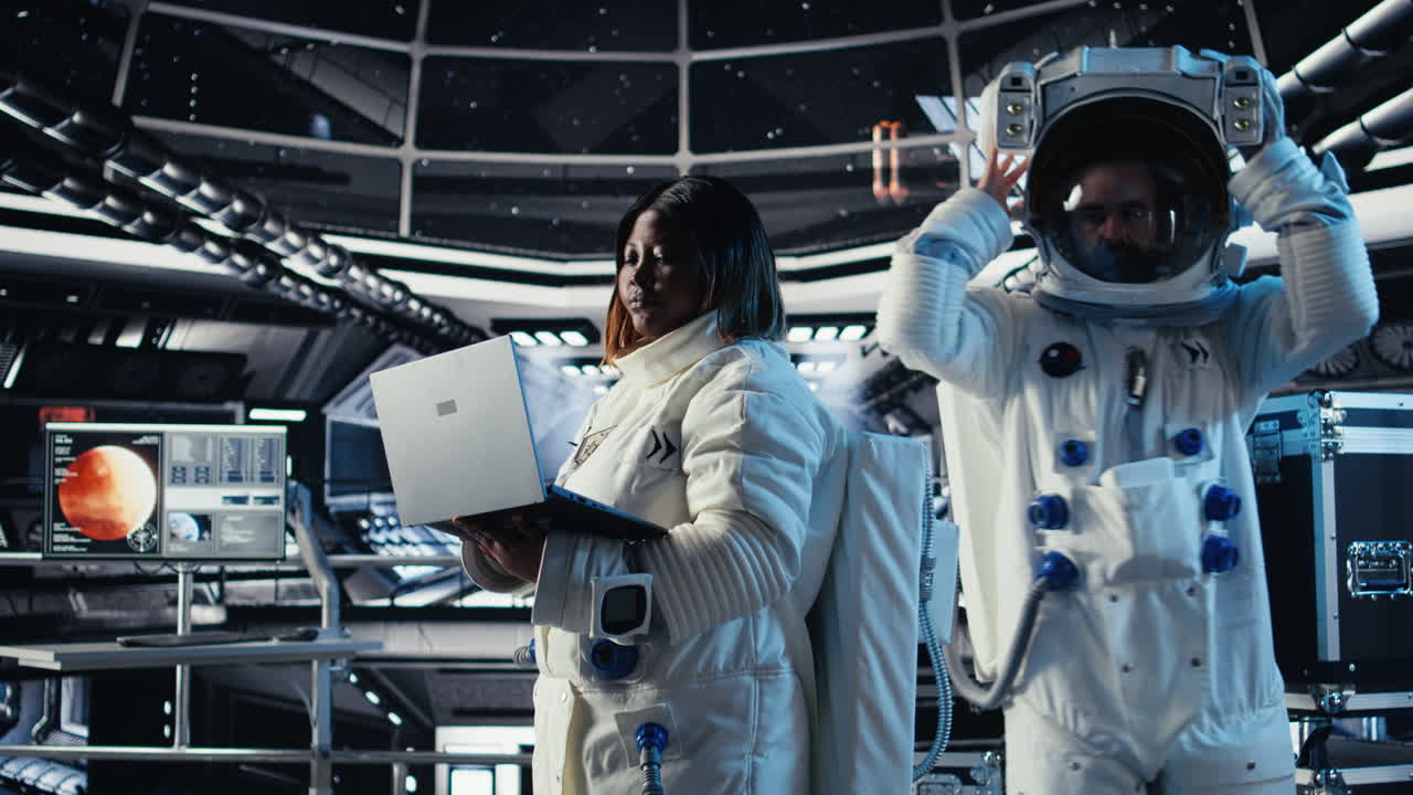 Cosmonaut leaving starship after landing on planet, waving hand to colleague