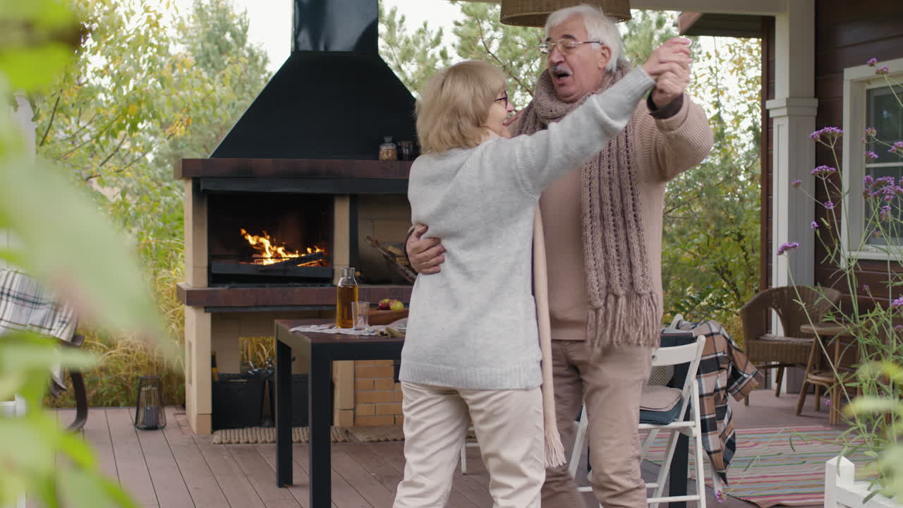 Elderly Couple Dancing on the Patio