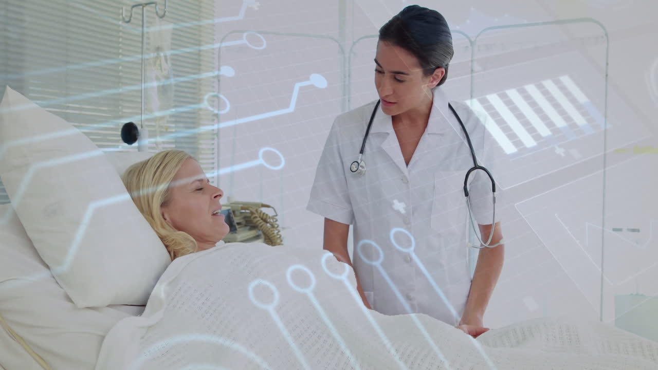 Attending patient, healthcare professional using medical technology in hospital room