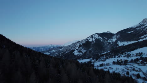 Flying-Through-Clouds-Above-Mountain-Tops-in-Winter-in-the-Alps-Italy