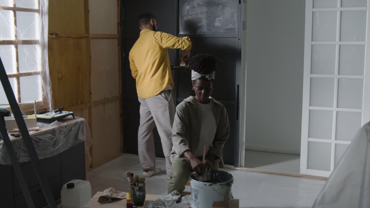 Couple Painting Home Interior