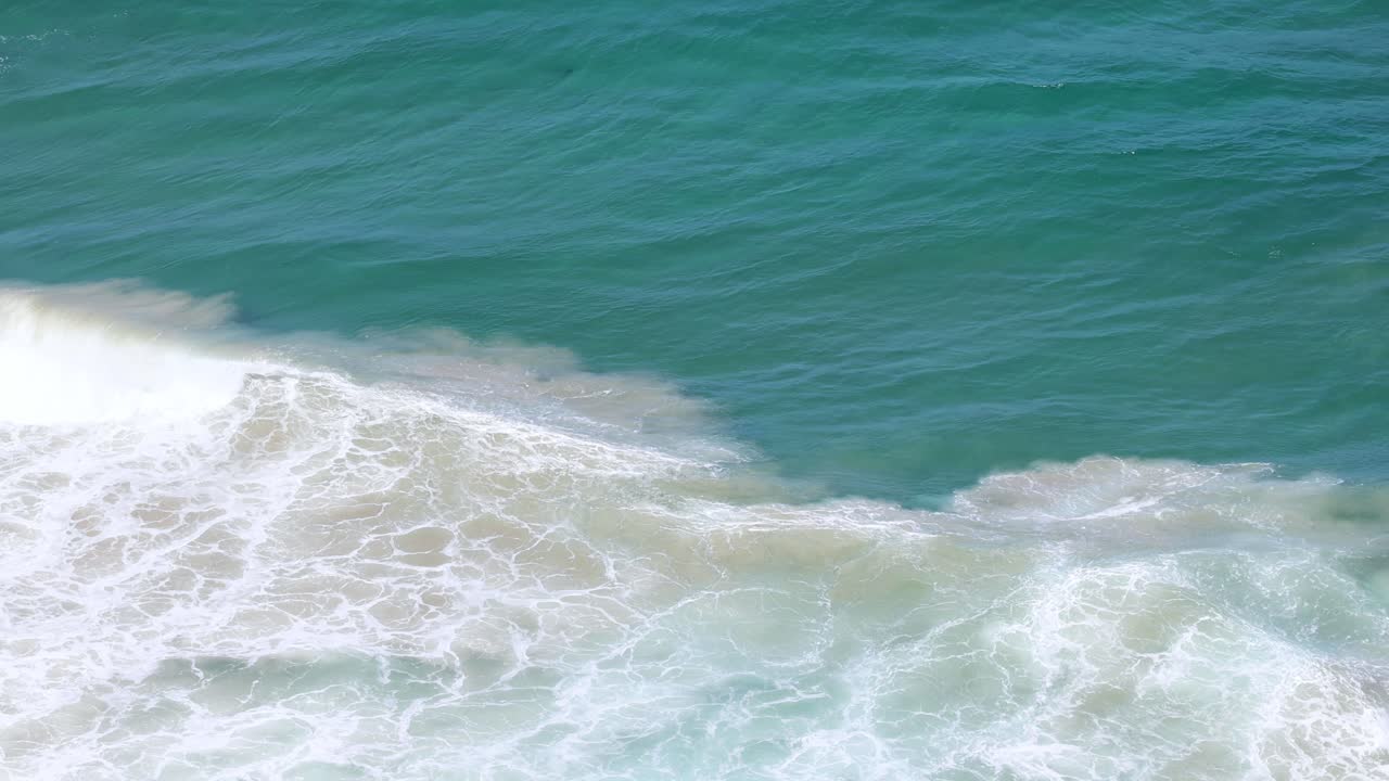 Sequential view of ocean waves breaking