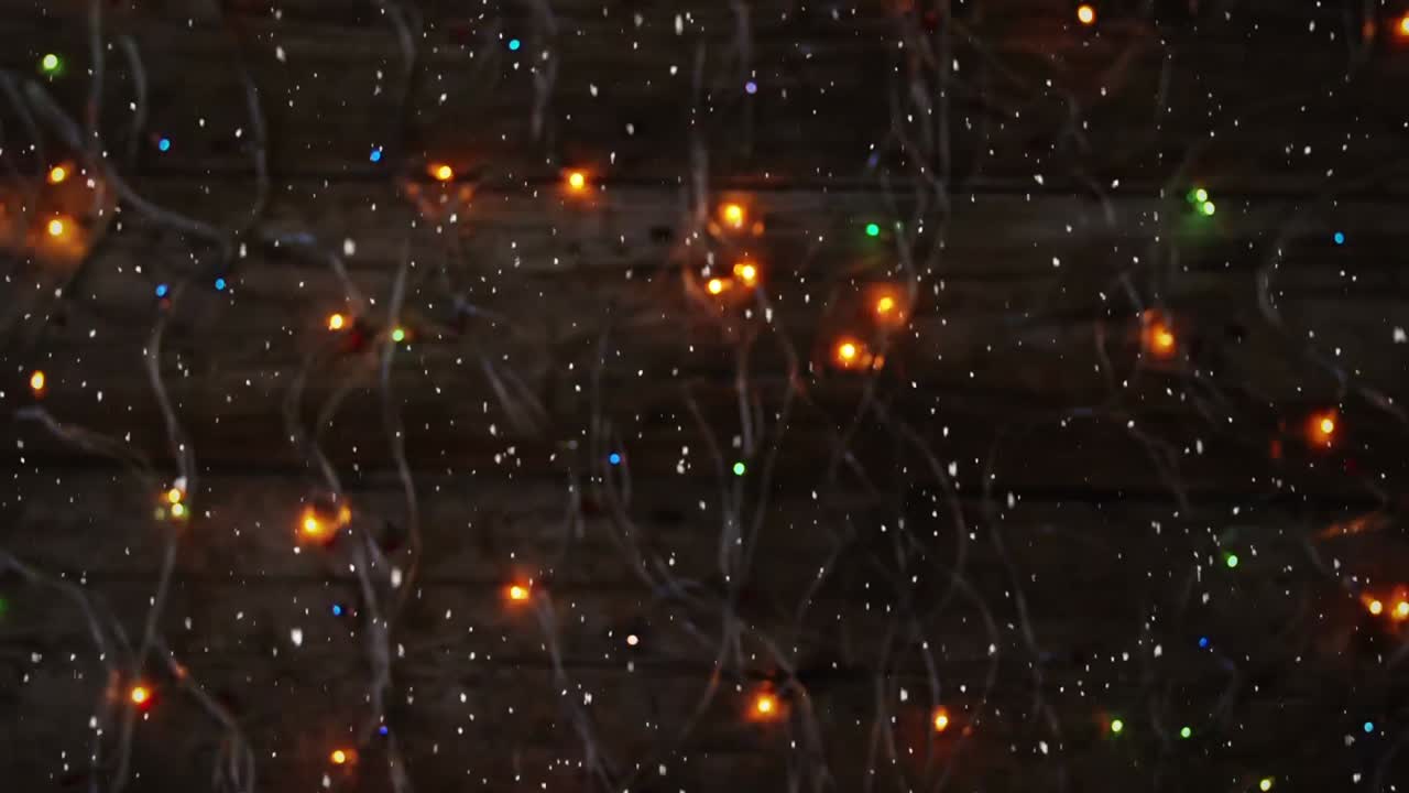 Videokompositio: lunta pöydällä olevien valojen päällä