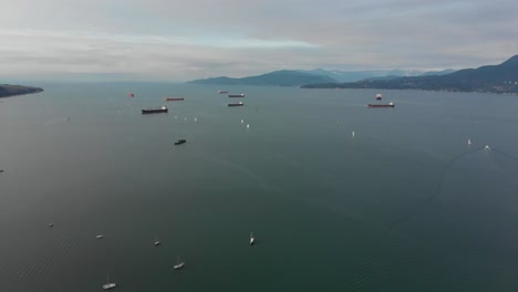 Various-drone-shots-at-English-Bay-near-downtown-Vancouver,-BC-during-Polar-Bear-2019-event