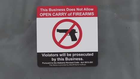 a posted signs bans the bringing of guns or firearms into a business