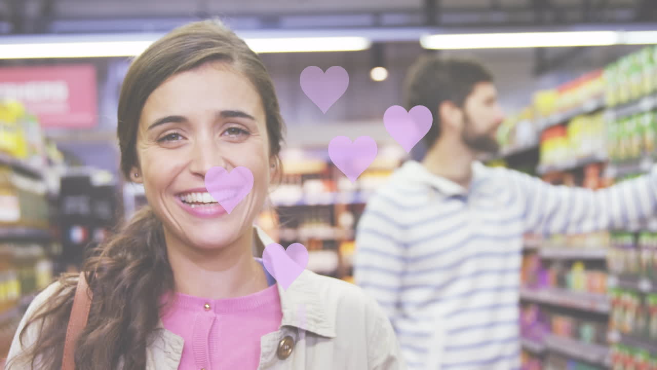 가게에 있는 백인 부부 위에 떨어지는 심장 아이콘의 애니메이션