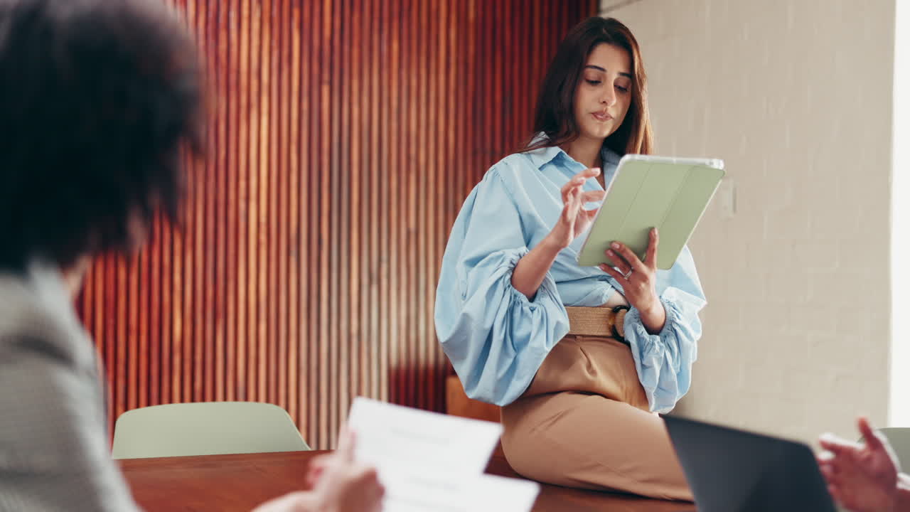 Business presentation with woman holding tablet