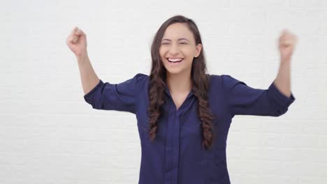 Excited-Indian-girl-cheering-and-having-fun