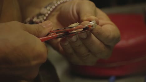 italian goldsmith at work building an engagement or a wedding ring