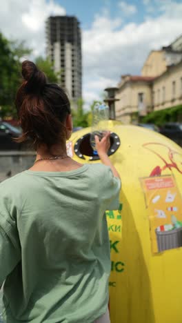 woman recycling plastic bottle