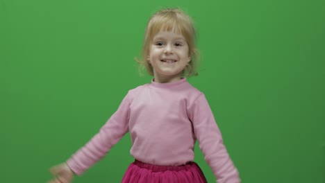 Happy-three-years-old-girl.-Cute-blonde-child.-Dancing-and-make-faces