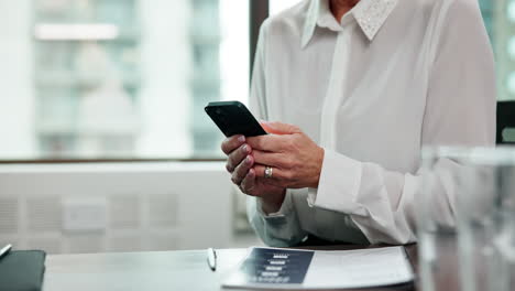 woman using mobile phone in office