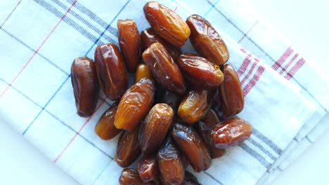 handful of dates on a checkered napkin