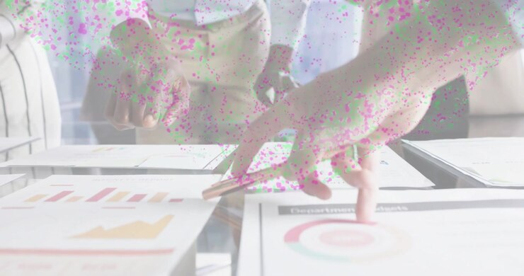Business colleagues pointing charts as man placing gold pen underlining results for analysis
