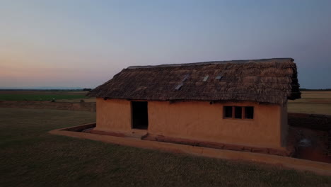 ancient mud house in rural landscape