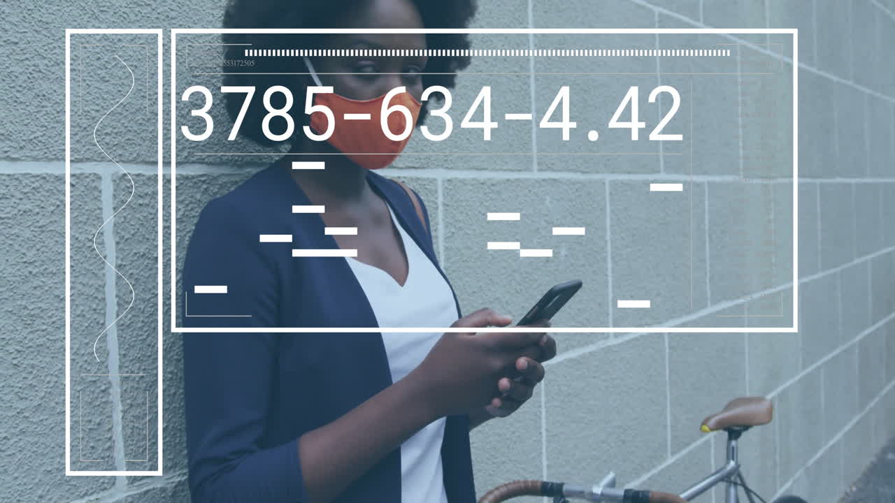 Animation of data processing over african american woman wearing face mask and using smartphone