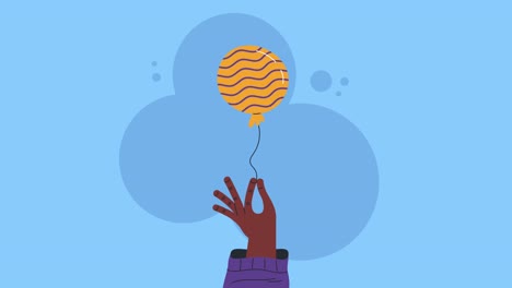 mano con un globo en la mano