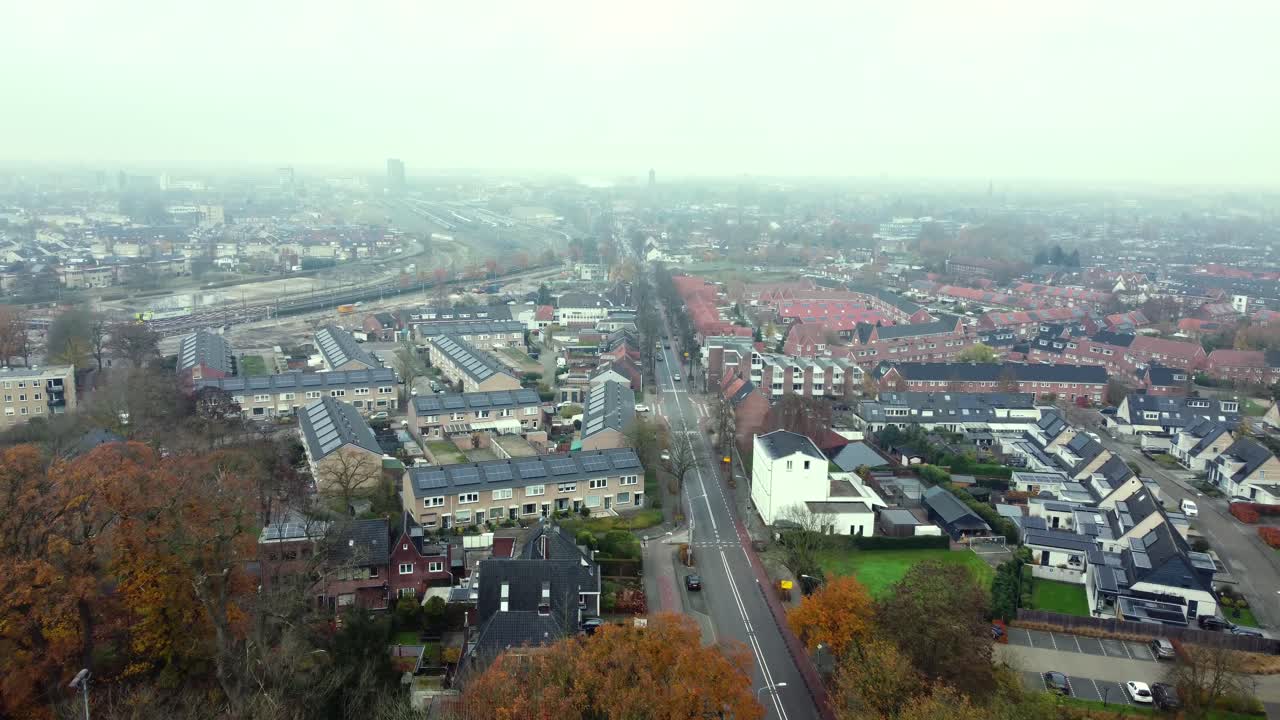 Foggy Cityscape with Houses and Street