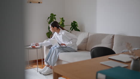 student girl texting laptop working apartment. woman studying computer online