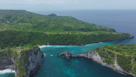 nusa penida coastline with jogglo viewpoint, atuh beach and nusa batupadasan island, tropical indonesia, aerial