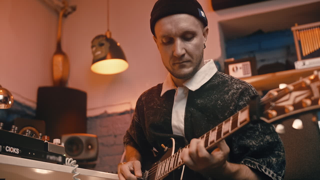 Musician Playing Electric Guitar in Recording Studio