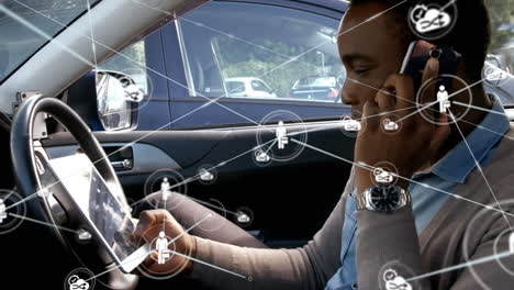 Network of connections against man with digital tablet talking on smartphone in car